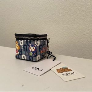 Blue Furla Animal Crossing Airpod case. Includes dustbag